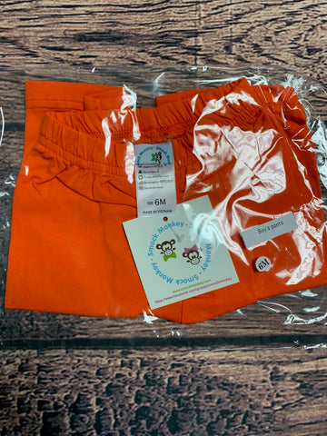 Boy's orange knit pants (6m)