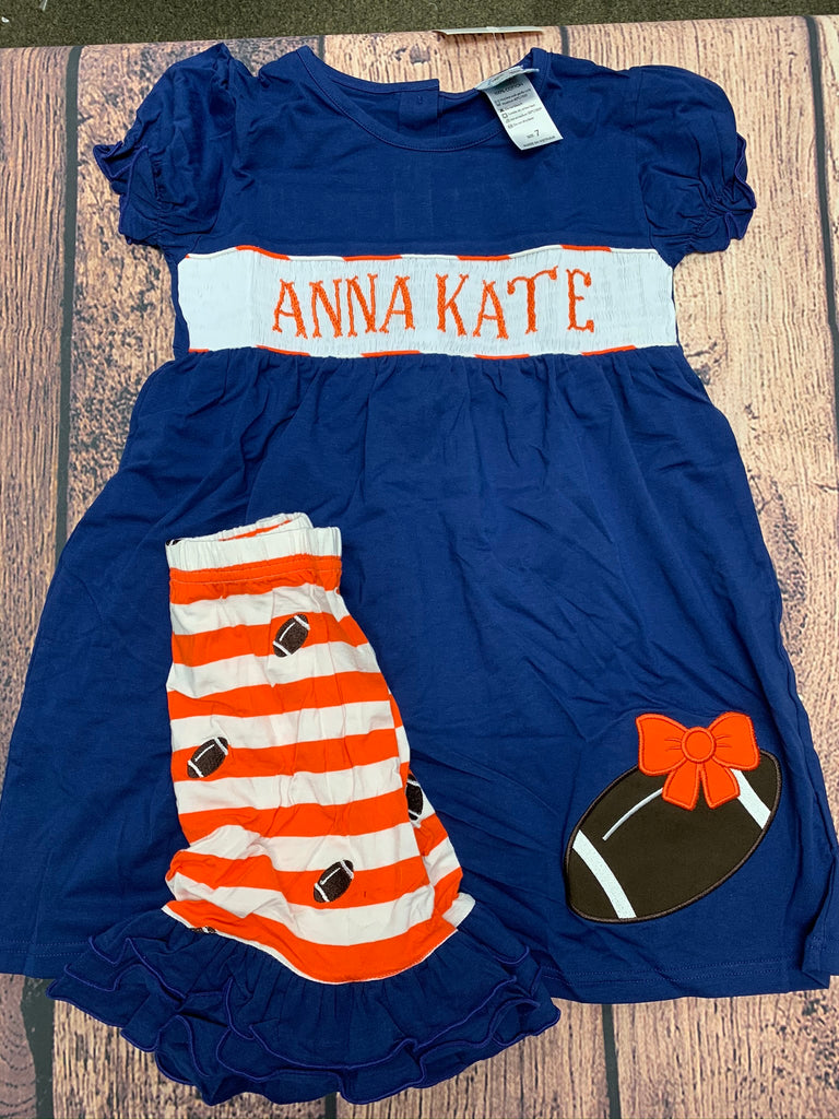 Girls smocked "PERSONALIZED" navy short sleeve shirt with football applique and orange and white embroidered football knit ruffle short set "ANNA KATE" (4t)