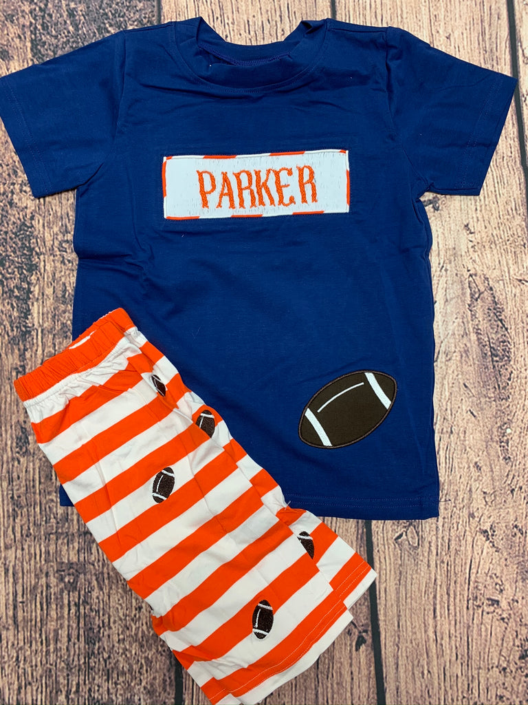 Boy's smocked "PERSONALIZED" navy short sleeve shirt with football applique and orange and white embroidered football knit short set "PARKER" (4t)