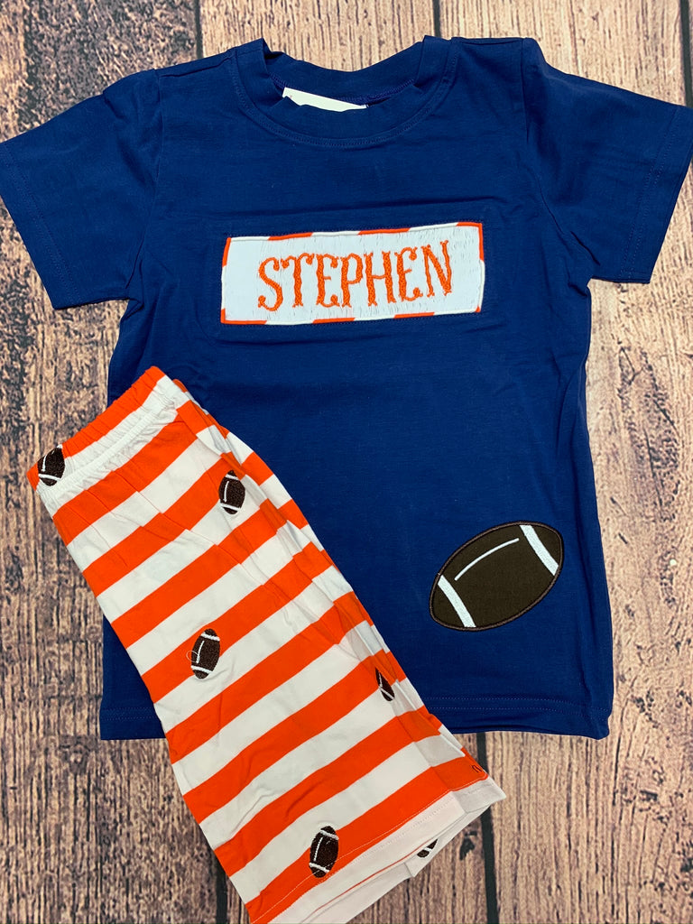 Boy's smocked "PERSONALIZED" navy short sleeve shirt with football applique and orange and white embroidered football knit short set "STEPHEN" (4t)
